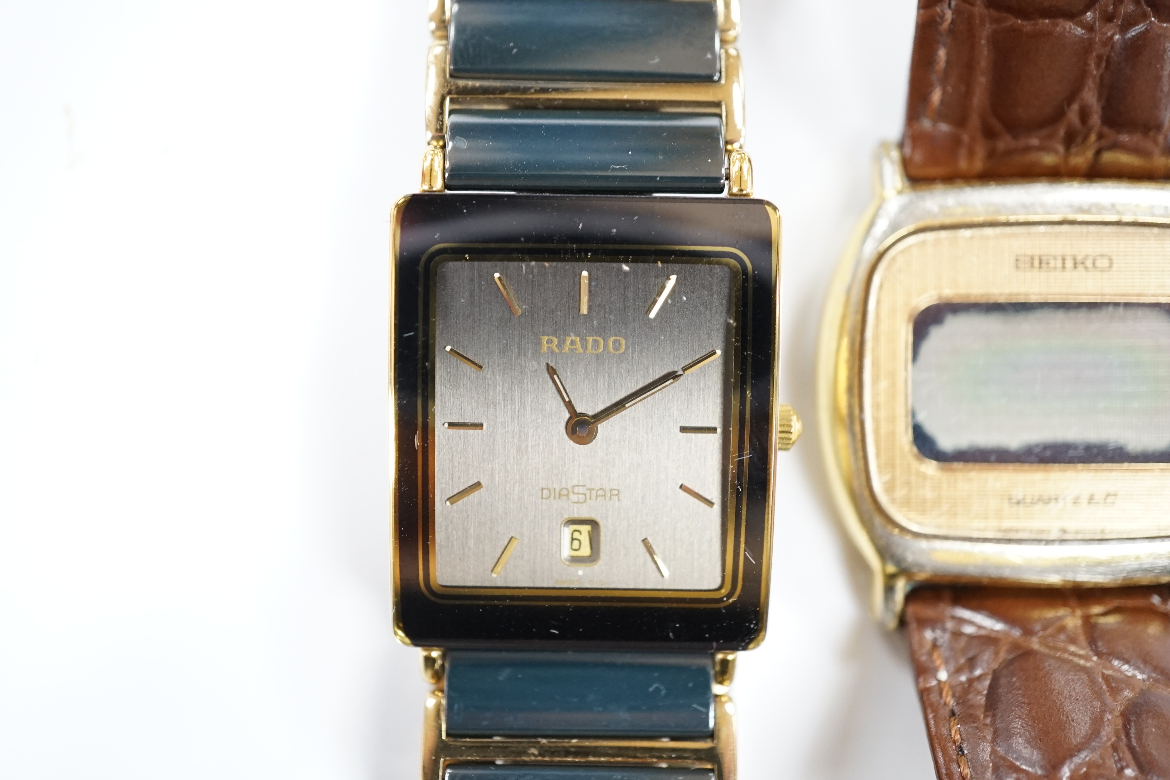 A gentleman's ceramic and gilt steel Rado Diastar wrist watch and a Seiko wrist watch.